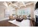 Cozy living room with coffered ceiling, hardwood floors, and plenty of natural light at 3309 Nw Past Nw Pl, Kennesaw, GA 30152