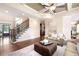 Open living space with hardwood floors, a coffered ceiling, and staircase at 3309 Nw Past Nw Pl, Kennesaw, GA 30152