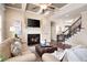 A cozy living room with a fireplace, coffered ceiling, and comfortable seating at 3309 Nw Past Nw Pl, Kennesaw, GA 30152