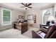 Bright office with two windows, a ceiling fan, desk, and leather chairs at 3309 Nw Past Nw Pl, Kennesaw, GA 30152