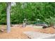 Community playground with slides, swings and picnic table for Gathering fun and enjoyment at 3309 Nw Past Nw Pl, Kennesaw, GA 30152