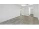 A bright bedroom with light walls and floors features an ensuite bathroom and walk-in closet at 346 Peters Sw St # 207, Atlanta, GA 30313