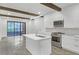 Kitchen with island, modern lighting, stainless appliances, and sliding glass doors at 346 Peters Sw St # 207, Atlanta, GA 30313