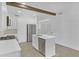 Bright kitchen with stainless steel appliances, island, and white cabinets at 346 Peters Sw St # 207, Atlanta, GA 30313
