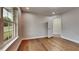 This bedroom features hardwood floors, large windows, and neutral paint throughout at 3681 Auger Trl, Douglasville, GA 30135