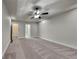This is a spacious main bedroom with fresh carpet, neutral paint, and a ceiling fan at 3681 Auger Trl, Douglasville, GA 30135