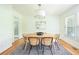 Bright dining room with hardwood floors, modern table and chairs at 1662 Rainier Falls Ne Dr, Atlanta, GA 30329