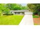 Charming single-story home featuring a well-manicured lawn and an attached two-car garage at 1662 Rainier Falls Ne Dr, Atlanta, GA 30329