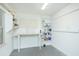 Clean white garage features shelves and a workbench at 1662 Rainier Falls Ne Dr, Atlanta, GA 30329