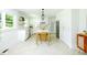 Modern kitchen with white cabinetry, stainless steel appliances, herringbone floors, and a functional island at 1662 Rainier Falls Ne Dr, Atlanta, GA 30329