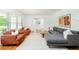 A bright living room with modern furniture, large windows, and hardwood floors at 1662 Rainier Falls Ne Dr, Atlanta, GA 30329