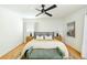 Main bedroom with hardwood floors and a decorative ceiling fan at 1662 Rainier Falls Ne Dr, Atlanta, GA 30329