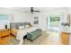 Main bedroom with hardwood floors, ceiling fan, and a sliding glass door at 1662 Rainier Falls Ne Dr, Atlanta, GA 30329
