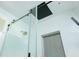 Modern tiled shower featuring a rain shower head, glass door, and built-in niche at 1662 Rainier Falls Ne Dr, Atlanta, GA 30329