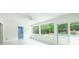 Bright sun room features tile floors, windows, fan, and sliding glass doors to the outside pool area and has access to laundry area at 1662 Rainier Falls Ne Dr, Atlanta, GA 30329