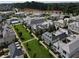 Stunning aerial view of community with well-manicured lawns, lush trees, and a sparkling community pool at 316 S Esplanade, Alpharetta, GA 30009