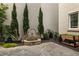 Landscaped patio featuring a stone fountain, attractive plantings and brick pavers at 316 S Esplanade, Alpharetta, GA 30009