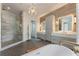 Luxurious bathroom with walk-in shower, freestanding tub, dual vanities, and elegant lighting at 316 S Esplanade, Alpharetta, GA 30009