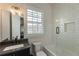 Stylish bathroom featuring a modern vanity, subway tile, and a shower-tub combination with sleek fixtures at 316 S Esplanade, Alpharetta, GA 30009