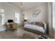 Bedroom featuring a light interior, modern furnishings, shutters, and minimalist decor at 316 S Esplanade, Alpharetta, GA 30009
