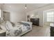 Inviting bedroom with hardwood floors, comfortable bed, built-in bookcase, and relaxing decor at 316 S Esplanade, Alpharetta, GA 30009