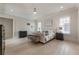 Bright and spacious bedroom with hardwood floors, plantation shutters, and stylish furnishings at 316 S Esplanade, Alpharetta, GA 30009