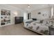 Cozy bedroom with built-in bookcase, plush bedding, and hardwood floors, creating a relaxing retreat at 316 S Esplanade, Alpharetta, GA 30009
