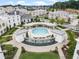 Community pool with ample seating and lush landscaping provides the perfect spot for relaxation and recreation at 316 S Esplanade, Alpharetta, GA 30009