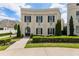 Charming two-story home features a manicured lawn and an elegant arched doorway at 316 S Esplanade, Alpharetta, GA 30009