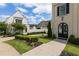 Charming two-story home featuring a manicured lawn and an elegant arched doorway at 316 S Esplanade, Alpharetta, GA 30009