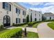 Charming two-story home features a manicured lawn and an elegant arched doorway at 316 S Esplanade, Alpharetta, GA 30009