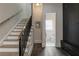 Hallway with stairs, black storage cabinets, and a view into a bathroom with a window at 316 S Esplanade, Alpharetta, GA 30009
