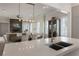 Open concept kitchen featuring a large island, modern lighting, and seamless integration with the living area at 316 S Esplanade, Alpharetta, GA 30009