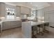 Bright kitchen features stainless steel appliances, gray cabinets, and a large island with seating at 316 S Esplanade, Alpharetta, GA 30009