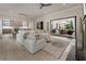 Open-concept living room flows into kitchen and features a cozy fireplace at 316 S Esplanade, Alpharetta, GA 30009