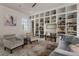 Inviting living room featuring built-in bookshelves, plush seating, and a colorful accent rug at 316 S Esplanade, Alpharetta, GA 30009