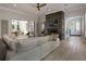 Spacious living room with fireplace, hardwood floors, and access to the outdoor patio at 316 S Esplanade, Alpharetta, GA 30009