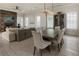 Open living and dining space boasts hardwood floors, a fireplace, and lots of natural light at 316 S Esplanade, Alpharetta, GA 30009