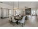 Open living and dining space with hardwood floors, neutral colors, and a peek into the fireplace at 316 S Esplanade, Alpharetta, GA 30009