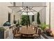 Backyard patio area with full dining set, outdoor kitchen and stone fountain at 316 S Esplanade, Alpharetta, GA 30009