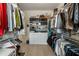 Spacious walk-in closet with custom shelving and hanging space for organized storage at 316 S Esplanade, Alpharetta, GA 30009