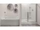 Bathroom featuring a soaking tub and a separate glass-enclosed shower at 319 Elgin Dr # 156, Lawrenceville, GA 30045