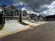 Charming townhome exteriors featuring modern designs and private garages in a well-maintained community at 319 Elgin Dr # 156, Lawrenceville, GA 30045