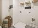 Bright laundry room featuring overhead storage, shelving, and charming decor accents for a functional and inviting space at 319 Elgin Dr # 156, Lawrenceville, GA 30045