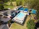 Aerial view of a community pool, tennis courts, and recreation center at 5302 Greenway Dr, Villa Rica, GA 30180