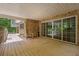 Covered wooden deck features sliding glass doors, and stairs to the backyard at 5302 Greenway Dr, Villa Rica, GA 30180