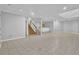 Open basement featuring tile flooring, a small bar area, and stairs at 5302 Greenway Dr, Villa Rica, GA 30180
