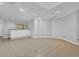 Finished basement features neutral tile flooring and a bar area at 5302 Greenway Dr, Villa Rica, GA 30180
