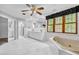 Bright bathroom featuring double vanity, soaking tub, glass shower, and ample natural light from window at 5302 Greenway Dr, Villa Rica, GA 30180