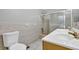 Full bathroom features double sinks and shower with sliding glass door at 5302 Greenway Dr, Villa Rica, GA 30180